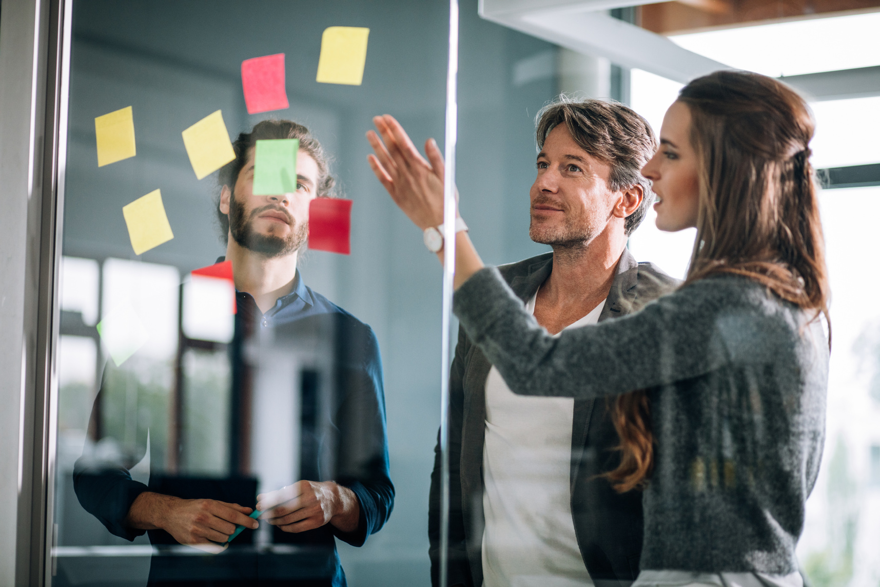 Young creative team mind mapping on post it notes